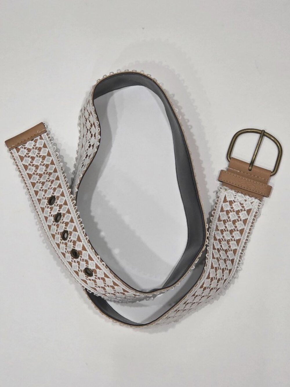 White lace-trim belt featuring a brown leather-look buckle